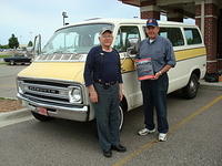Gene Malesko celebrates his Outstanding cruiser award for his 76 Ply Voyager