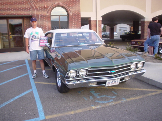 Dennis shows off his BoC award for his nice Malibu.