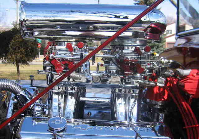 Chevy 355 with Chromed Edelbrock Tunnel Ram, Endura Shine Carburators, Mr. GasketAir Cleaner.